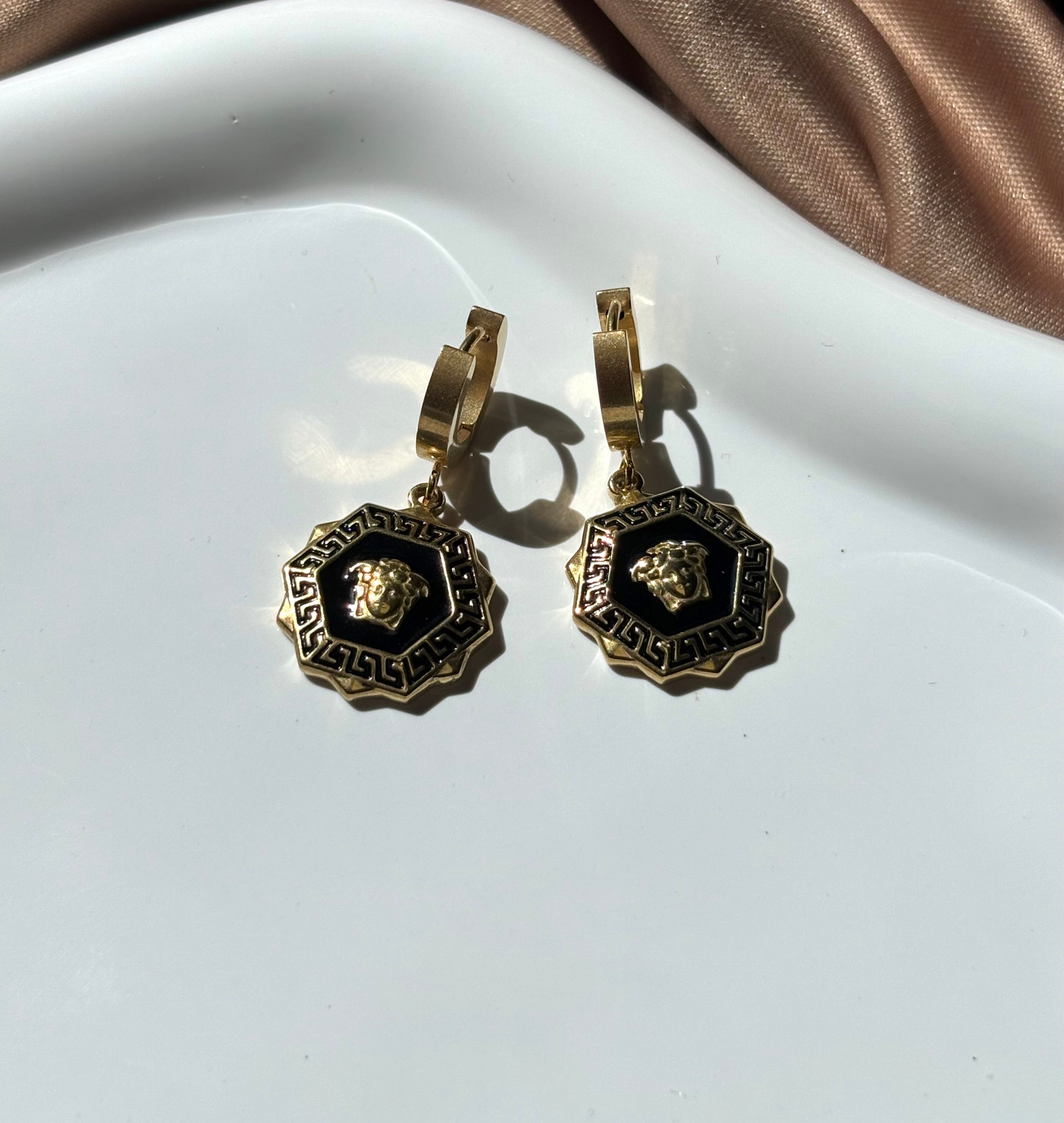 Medusa Medallion earrings.
