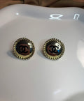 Button stud earrings.